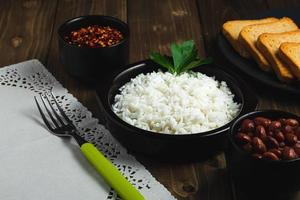 Dominican food with white rice and varius spices photo