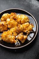 cauliflower with cheese baked vegetable meal food snack on the table copy space food background rustic top view photo