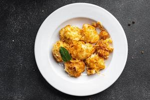 cauliflower with cheese baked vegetable meal food snack on the table copy space food background rustic top view photo