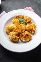 cauliflower with cheese baked vegetable meal food snack on the table copy space food background rustic top view photo