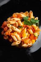 pasta salad tomato, cucumber, corn, fresh vegetable, penne pasta meal food snack on the table copy space food background rustic top view photo