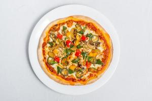 Hot fresh Chicken mushroom jalapeno pizza on white plate isolated white background. Homemade Pizza. Top views. photo