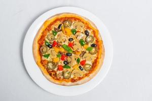 Hot fresh Chicken mushroom jalapeno pizza on white plate isolated white background. Homemade Pizza. Top views. photo