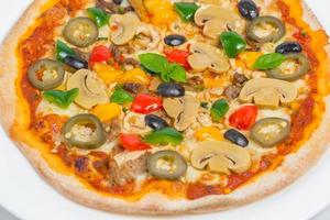 Closeup of Chicken mushroom jalapeno and red pepper pizza on white plate isolated on white background. Homemade Pizza. photo