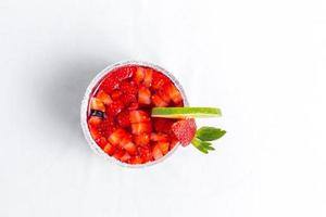 Top view of frozen strawberry and lime margarita. Valentine's dessert recipe. Strawberry juice. photo