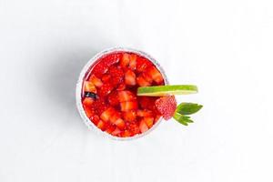 Top view of frozen strawberry and lime margarita. Valentine's dessert recipe. Strawberry juice. photo