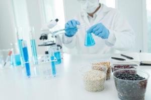 Scientist check chemical whole grains residues in laboratory. Control experts inspect the concentration of chemical residues. hazards, standard, prohibited substances, contaminate, Microbiologist photo