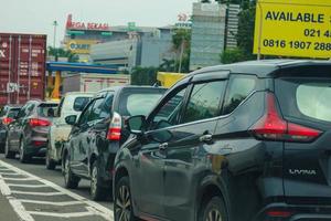 Close up photo of a back lamp of car that stuck in a traffic jam on the highway,