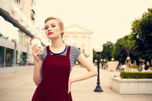 pretty woman glass with drink walk outdoors lifestyle photo