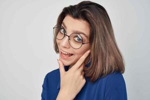 elegant woman wearing glasses blue shirt studio photo