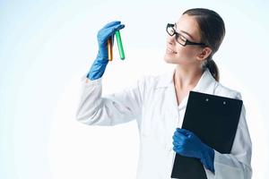 cheerful woman laboratory assistant chemical solution analyzes research light background photo