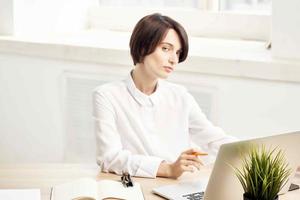 woman in costume in front of laptop documents Professional Job isolated background photo