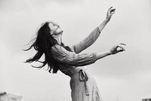 portrait of a beautiful woman long hairstyle in outdoor wedding dress black and white photo