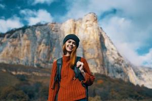 cheerful woman hiker nature landscape rocky mountains travel photo