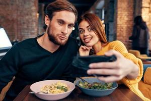 cheerful young couple restaurant leisure entertainment communication photo