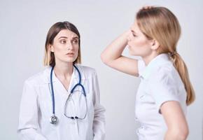 The patient complains to the doctor at will and a blue stethoscope photo