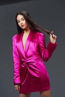 pretty woman in pink dress fashion makeup glamor isolated background photo