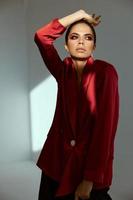 pretty woman in red jacket bright makeup studio luxury photo