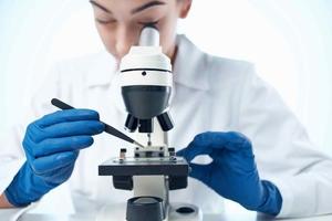 woman scientist laboratory microscope research medicine photo
