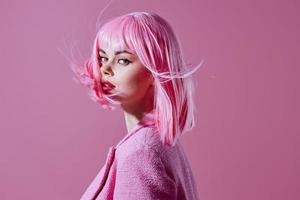 Young woman attractive look pink wig stylish clothes color background unaltered photo