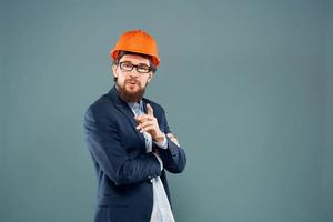 Engineer in orange paint job industry professional construction blue background photo