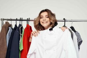 cheerful woman in a red jacket near the wardrobe emotions photo