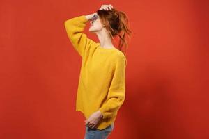 woman in yellow sweater posing blue glasses fashion photo