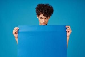 guy holding blue banner advertisement copy space isolated background photo