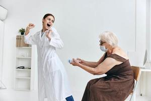 old woman at the doctor's appointment big syringe fun photo