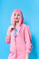 woman in pink wig posing fashion glasses photo