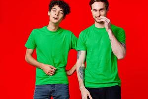 two friends green t-shirts emotions communication joy photo