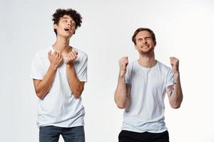 cheerful men in white t-shirts friendship emotions lifestyle photo