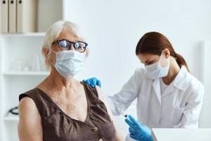 elderly woman patient next to the doctor covid-19 passport photo