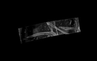 adhesive plastic tape isolated on black background photo