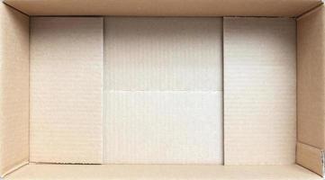 Open empty brown cardboard box background top view photo