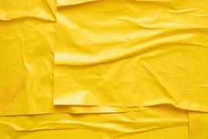 Blank yellow crumpled and creased paper poster texture background photo