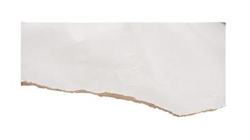 piece of white paper tear isolated on white background photo