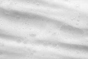 Abstract white soap foam bubbles texture background photo