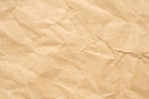 Abstract crumpled and creased recycle brown paper texture background photo