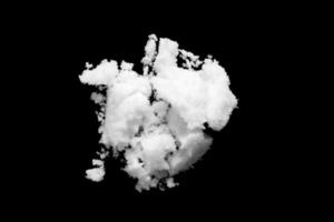 White snow isolated on black background close up photo