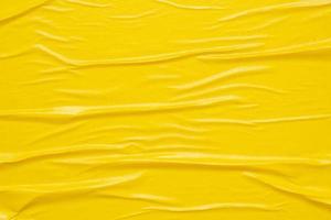 Blank yellow crumpled and creased paper poster texture background photo