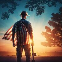 Attractive man in work clothes holding tools and a US flag. photo