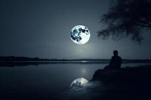 Moon night man near river. Generate Ai photo