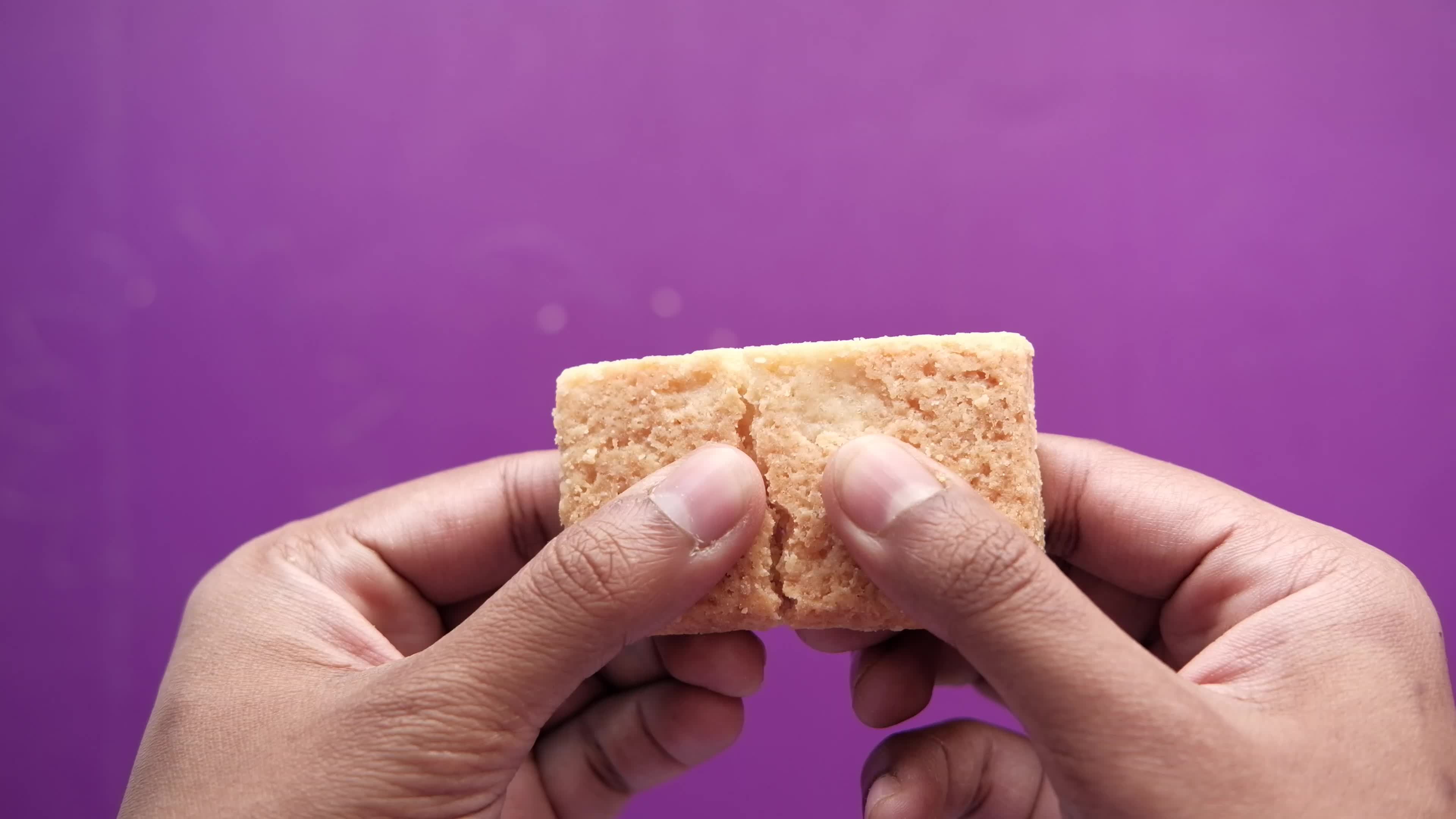 hand pick a whole wheat cracker 22649197 Stock Video at Vecteezy