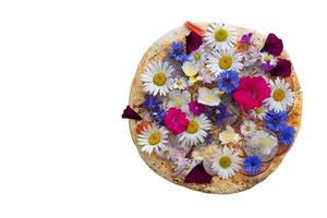 Creative pizza covered with colorful flowers.Piece of creative pizza photo