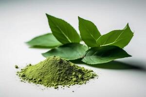 Green matcha tea powder on white background. Floral background. , photo