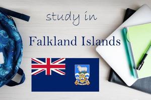 Study in Falkland Islands. Background with notepad, laptop and backpack. Education concept. photo