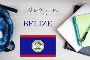 Study in Belize. Background with notepad, laptop and backpack. Education concept. photo