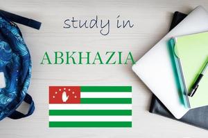 Study in Abkhazia. Background with notepad, laptop and backpack. Education concept. photo