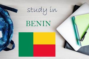 Study in Benin. Background with notepad, laptop and backpack. Education concept. photo